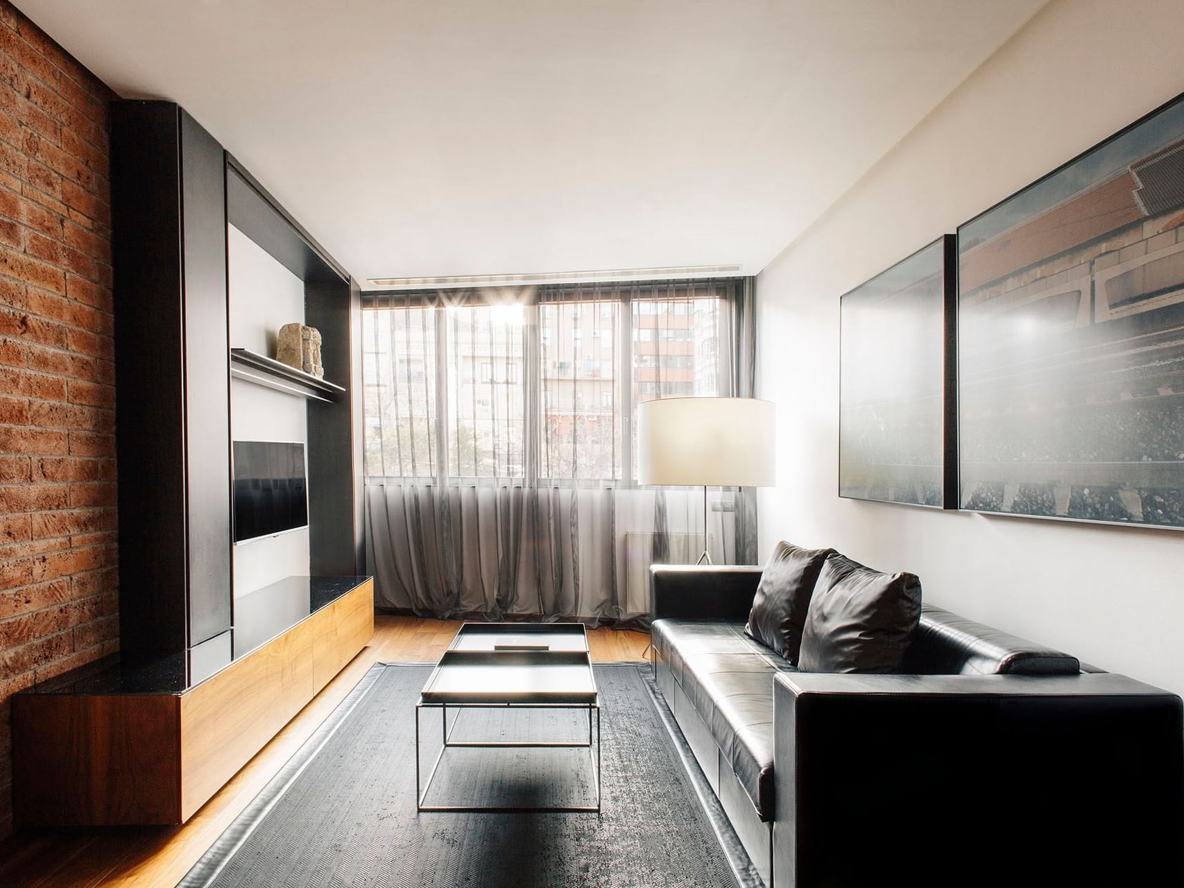 Livingroom area in Deluxe room at Barcelona Apartment