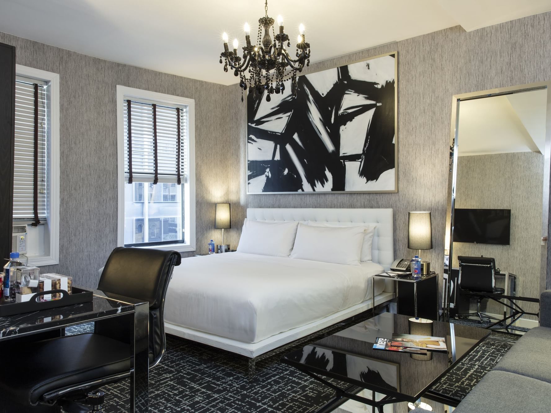 Square Hotel NYC King Deluxe Room with large king bed and black chandelier