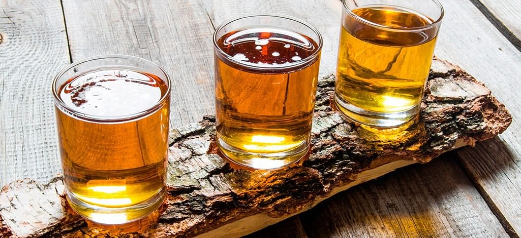 Three drinks on birch stand