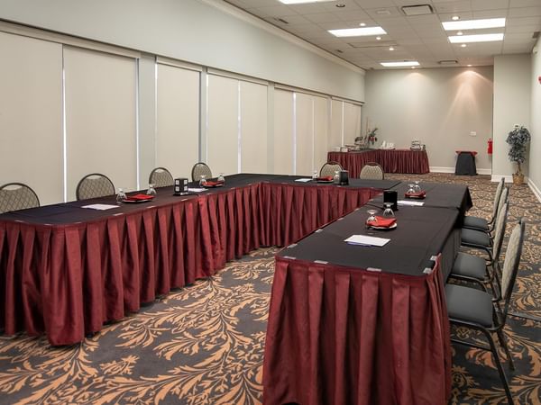 Event room with long tables and chairs.