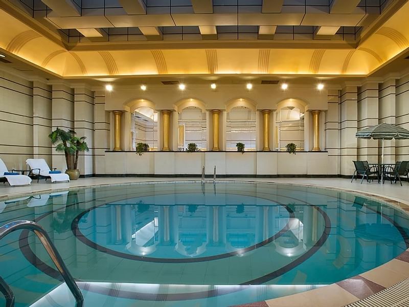 Indoor swimming Pool with loungers at Celebrity International Grand Hotel