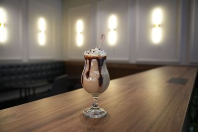 Frosted dessert drink, served on a table at Dann Carlton Cali, one of the best restaurants in Cali Colombia