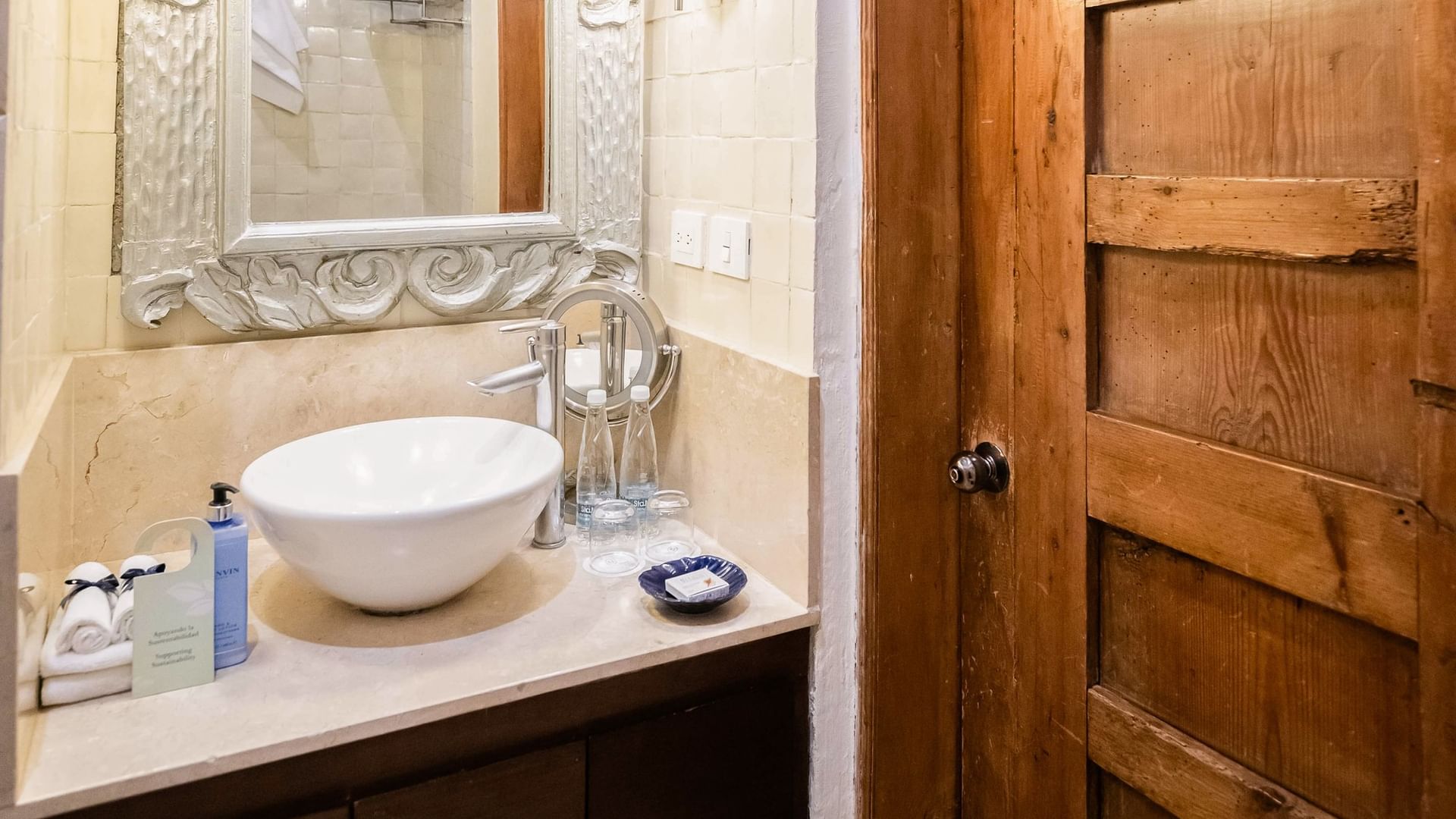 Elegant bathroom sink and mirror in King Superior room at Quinta Real Puebla in Heroica Puebla de Zaragoza.