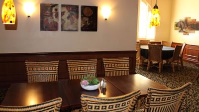 restaurant dining table with wicker chairs