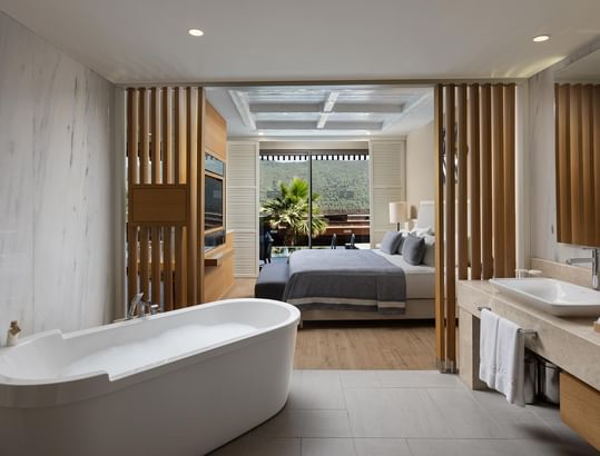 A luxurious bathroom with a large bathtub at Titanic Luxury Collection Bodrum.