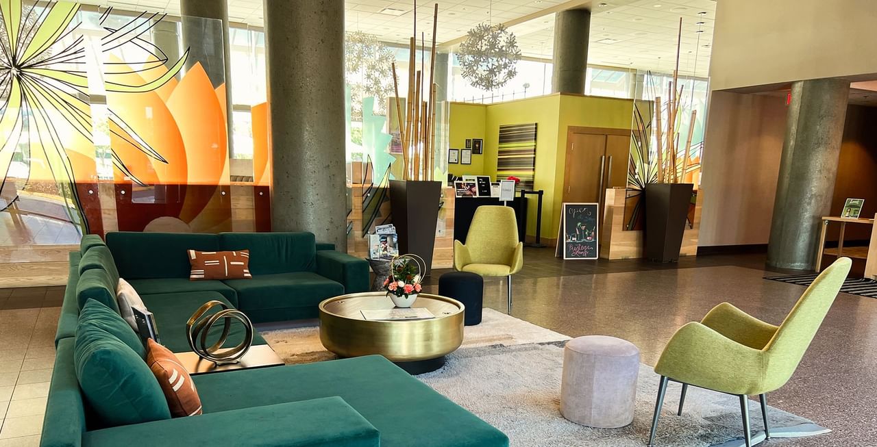 Lobby of hotel with couches, decorations and tables