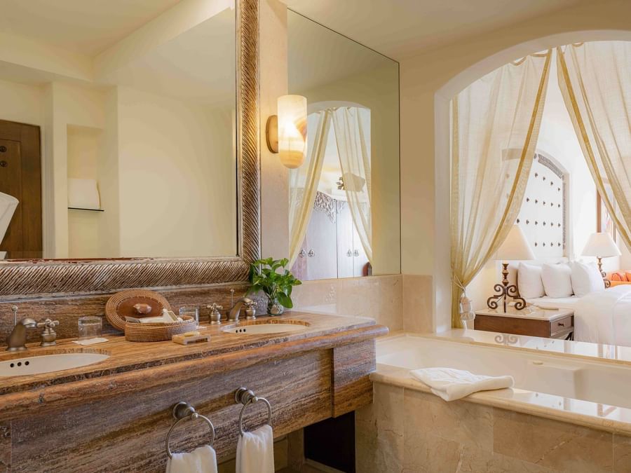 Junior Suite Ocean view open bathroom with vanity area and bathtub at Marquis Los Cabos Resort