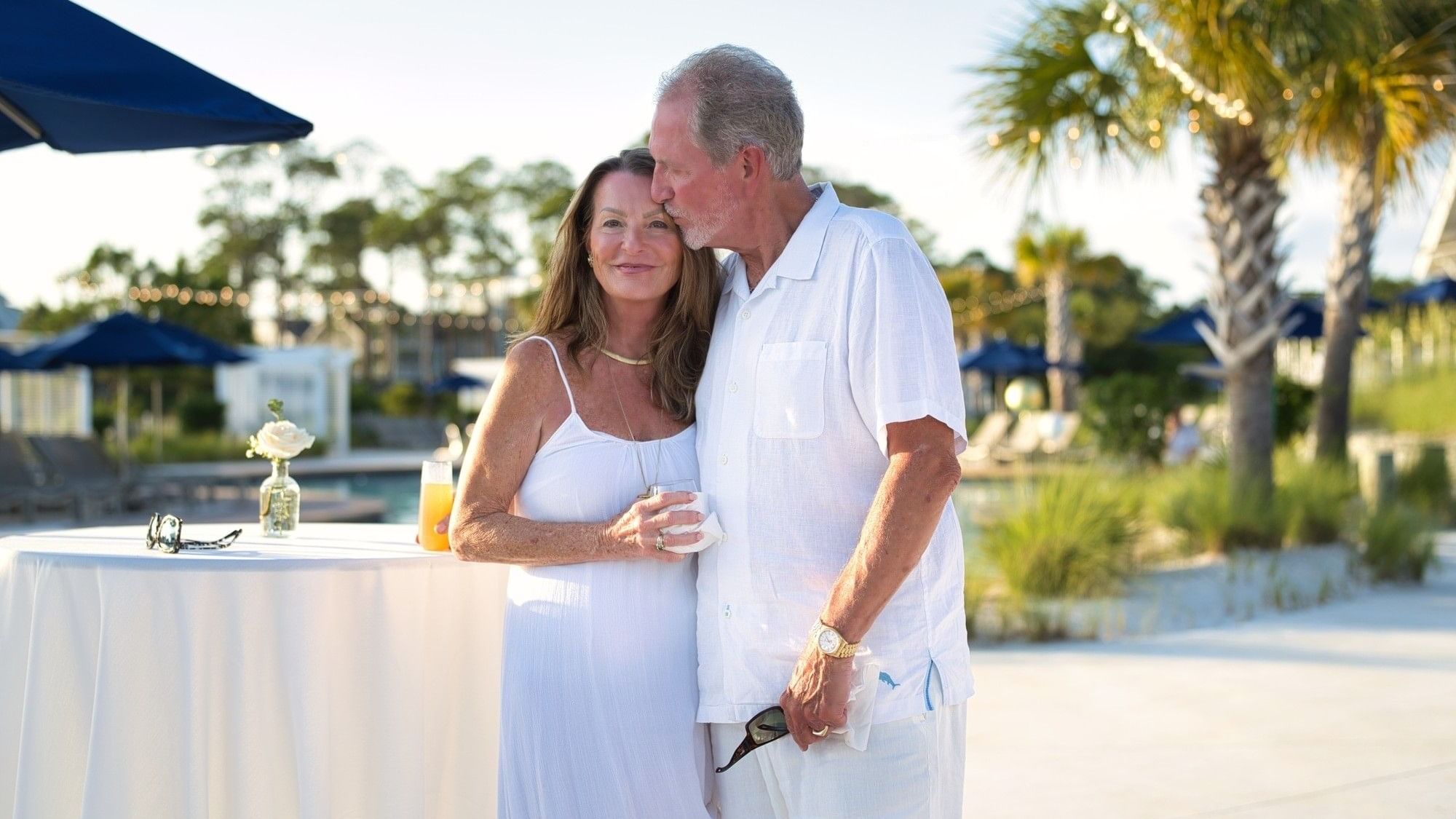 Couple standing close together near a table with drinks for Valentine’s Day Escape.