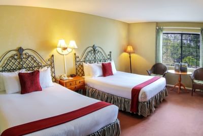 Two queen beds with forest view