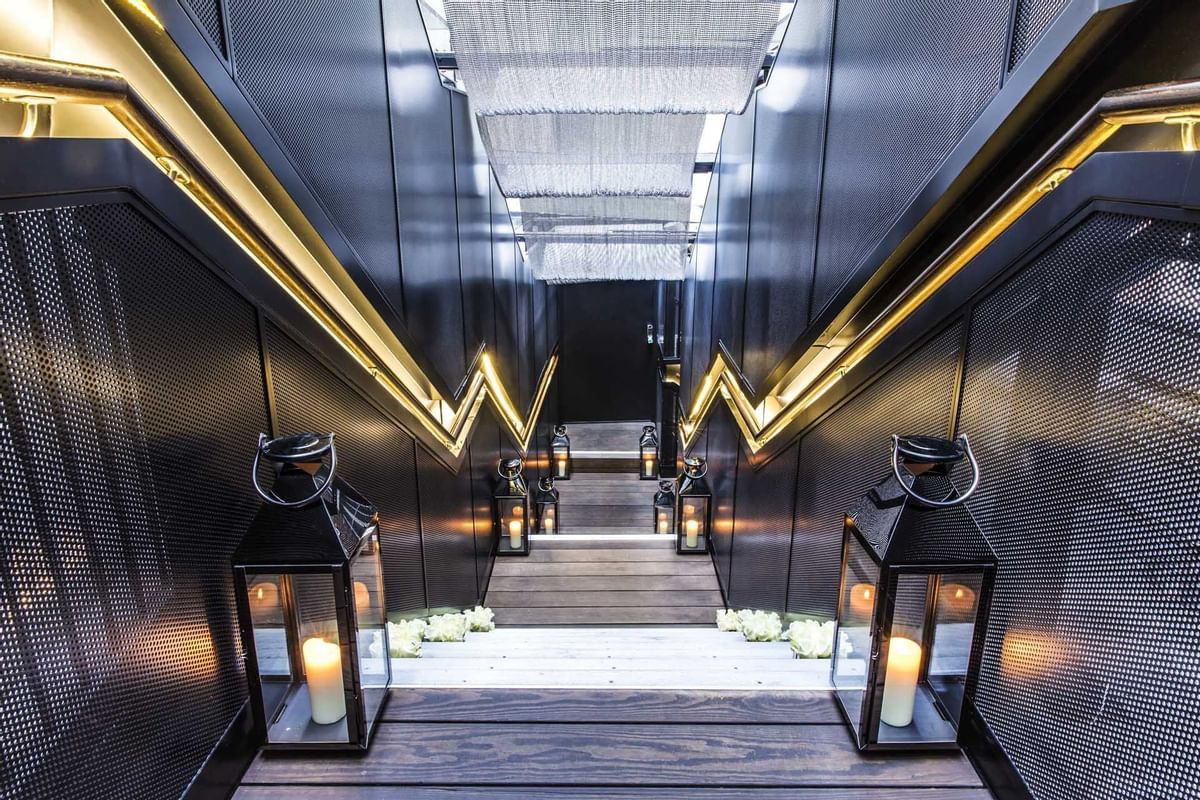 Lighted Staircase with candle lights at May Fair Hotel London