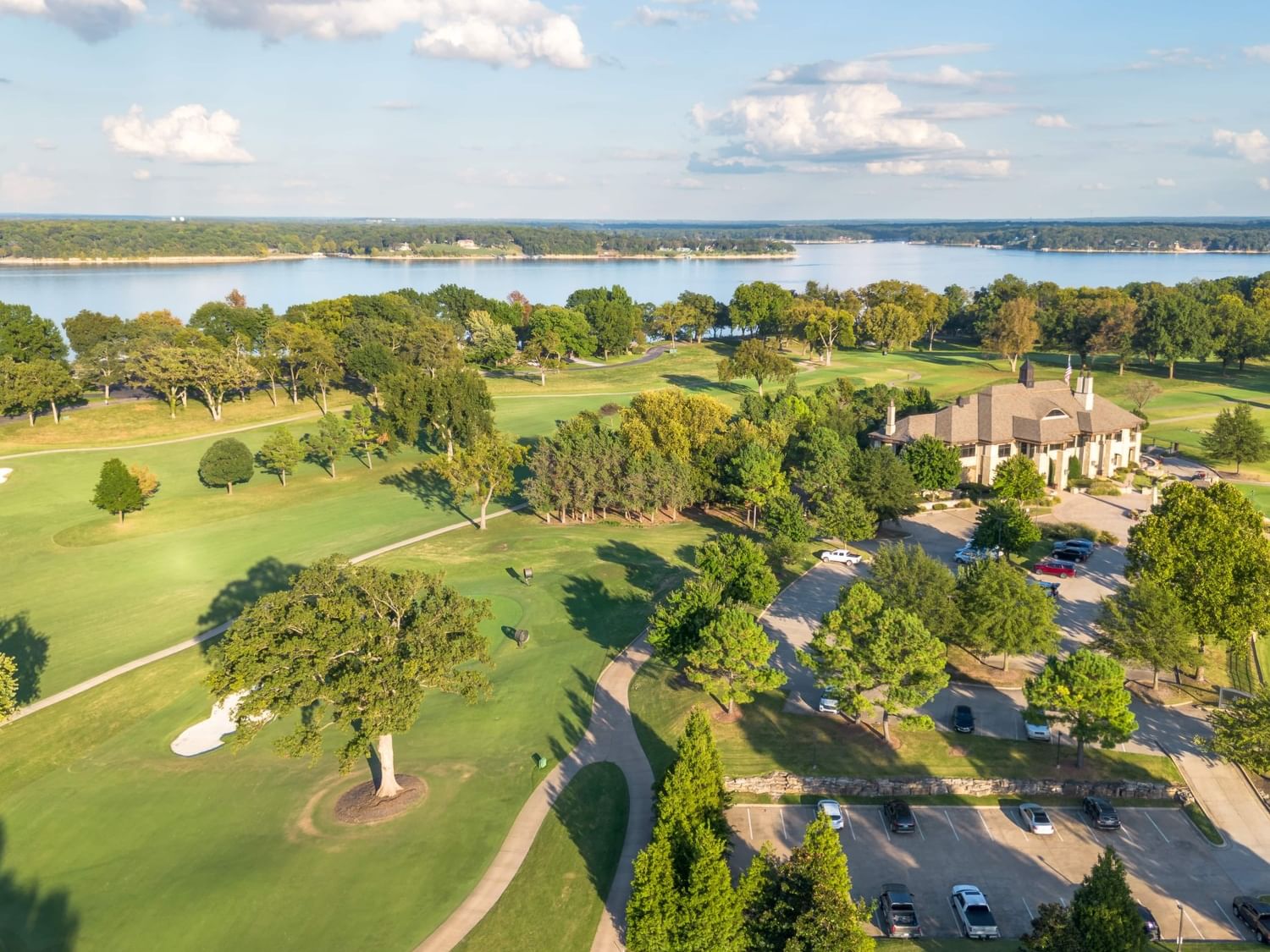 Aerial view of Champions Nine golf course with a lake at Shangri-La Resort