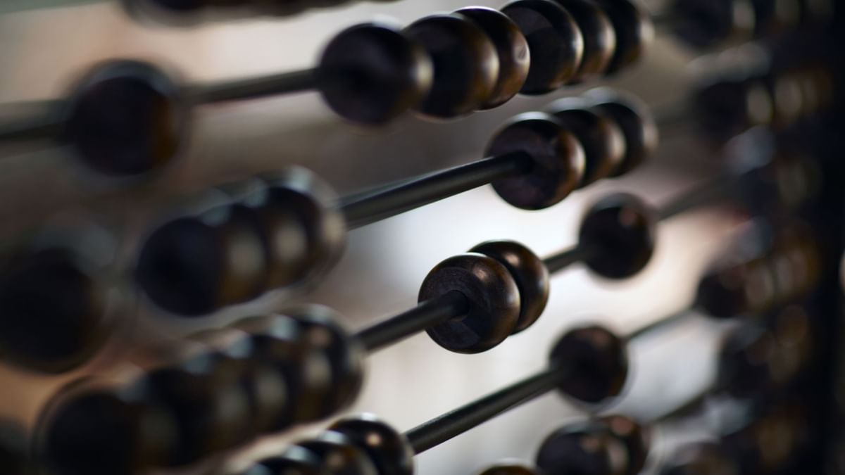 Close-up of an abacus with wooden beads blurred in 88 Noodle Bar at Crown Hotels