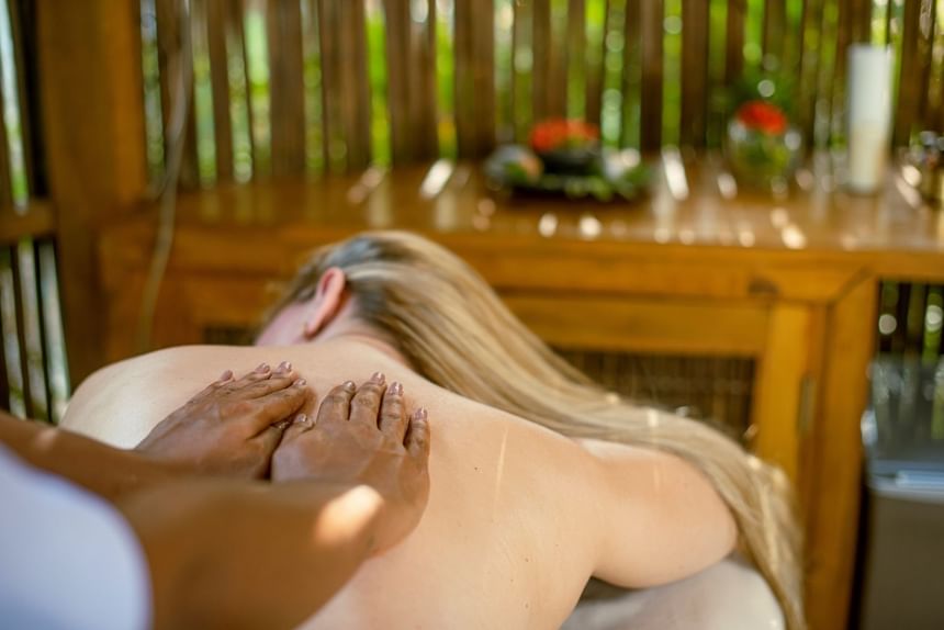 A lady having a massage in the spa at Hotel Isla Del Encanto