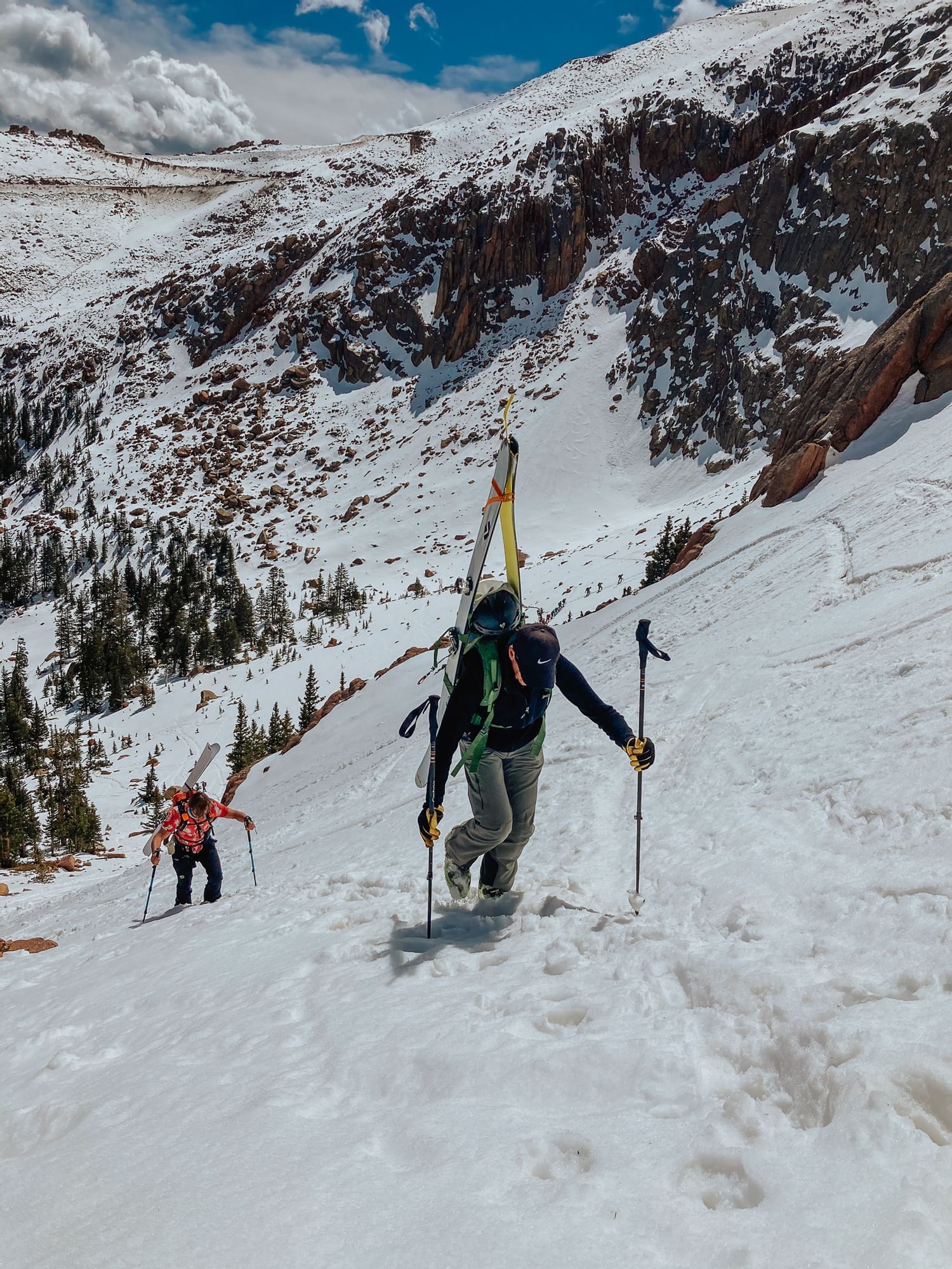 People skiing in the snow mountains near Kinship Landing