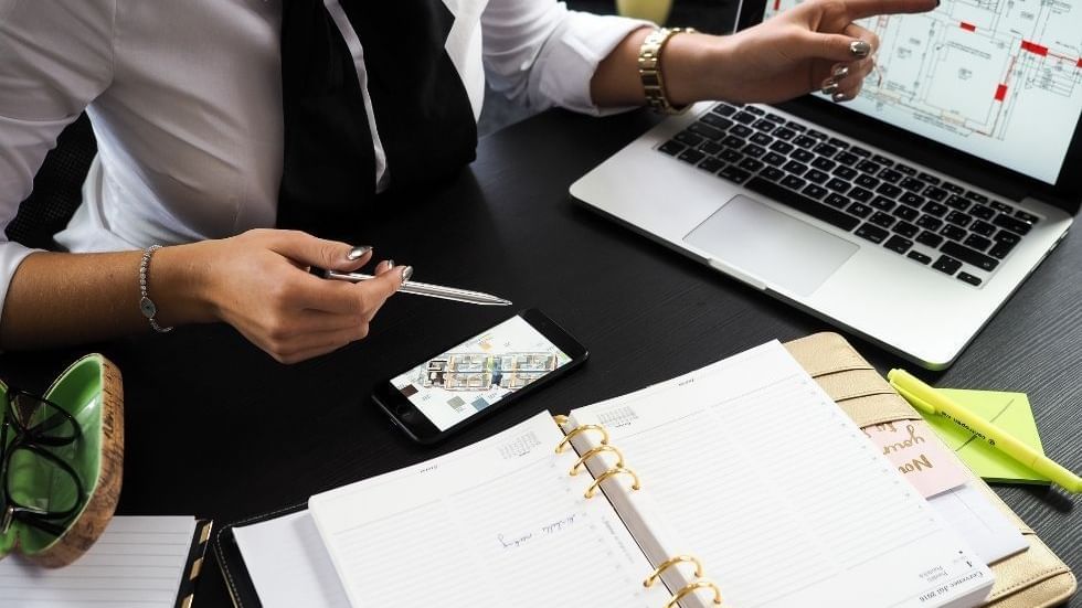 A person working at a desk with a laptop at Sunway Hotel Big Box