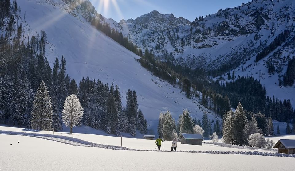 View of snowy mountains from ground near Hotel Liebes Rot Flueh