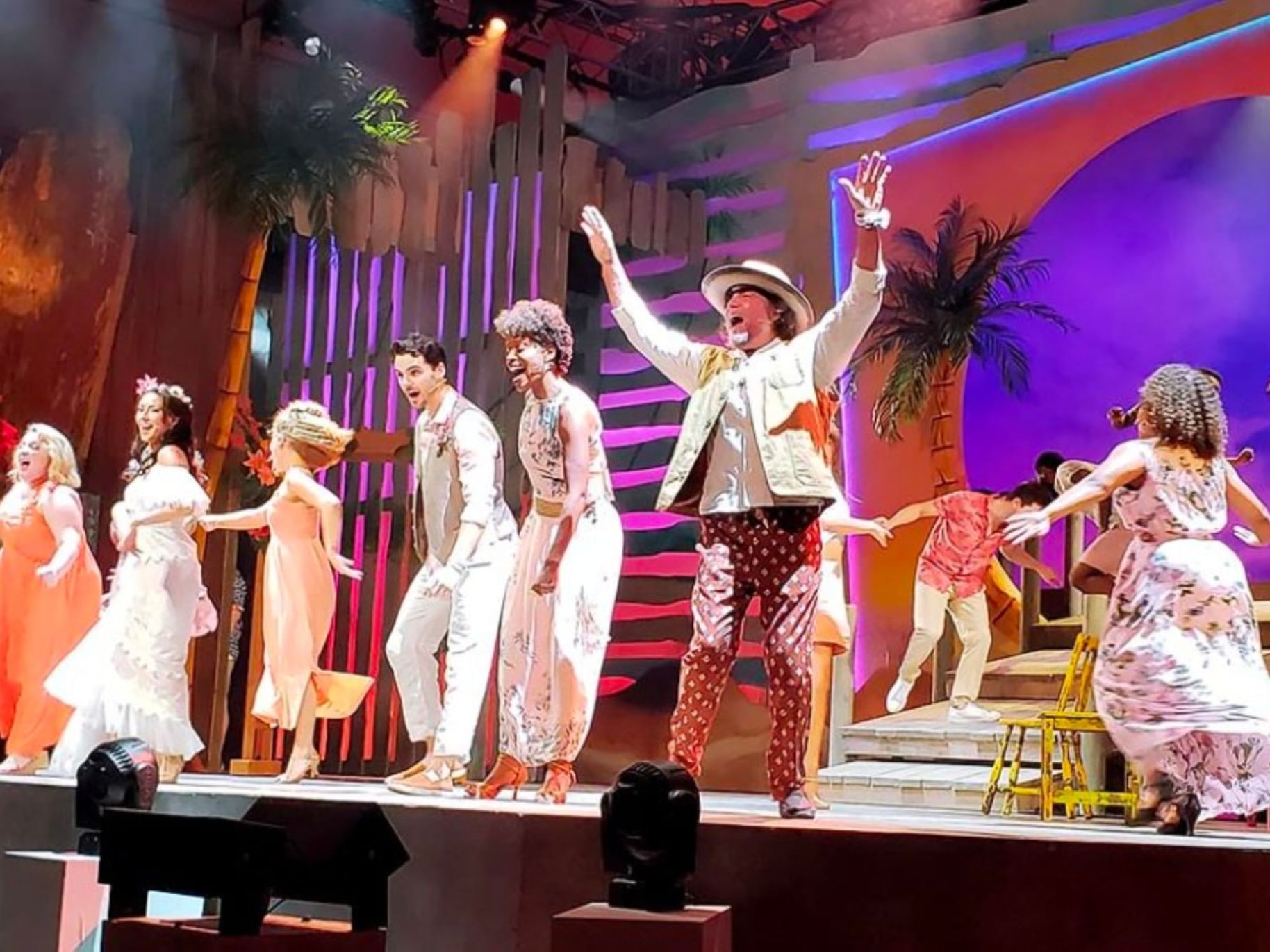 People presenting a show on the stage of Ogunquit Playhouse near Ogunquit River Inn