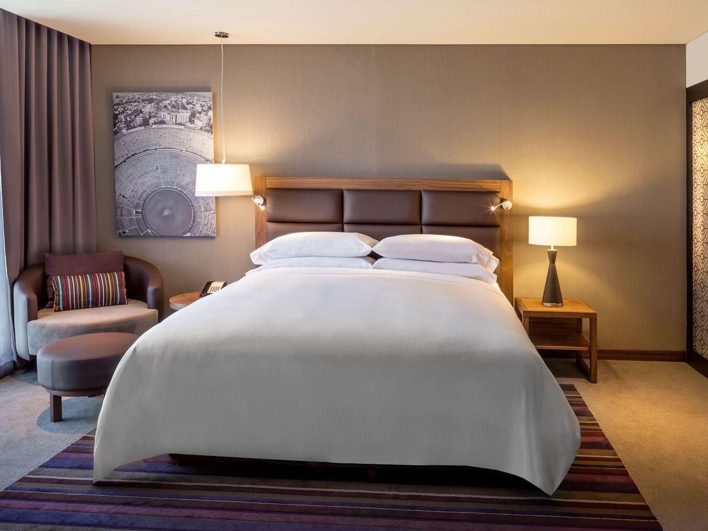 Nightstands & lounger by the bed in Master Suite, 1 King at Fiesta Americana