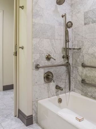 Accessible Executive Front Suite bathroom with bathtub and grab bars at Warwick San Francisco.