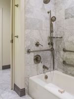 Accessible Executive Front Suite bathroom with bathtub and grab bars at Warwick San Francisco.