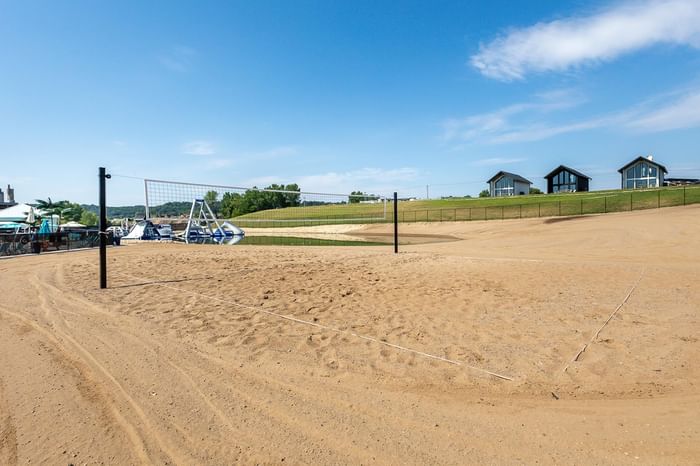 A volleyball net on the sandy beach near Off Shore Resort