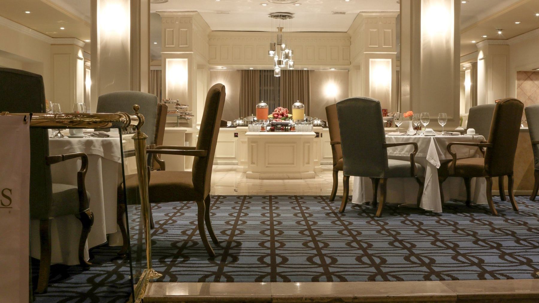 Buffet display by a dining area in a Restaurant at Gamma Hotels