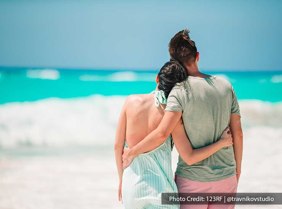 happy couple enjoying and relaxing on the beach - Grand Lexis PD