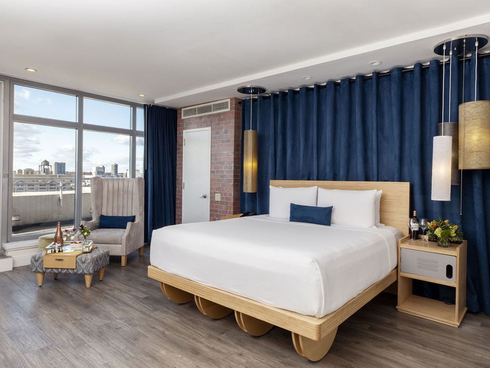 a bed and chair in a hotel room