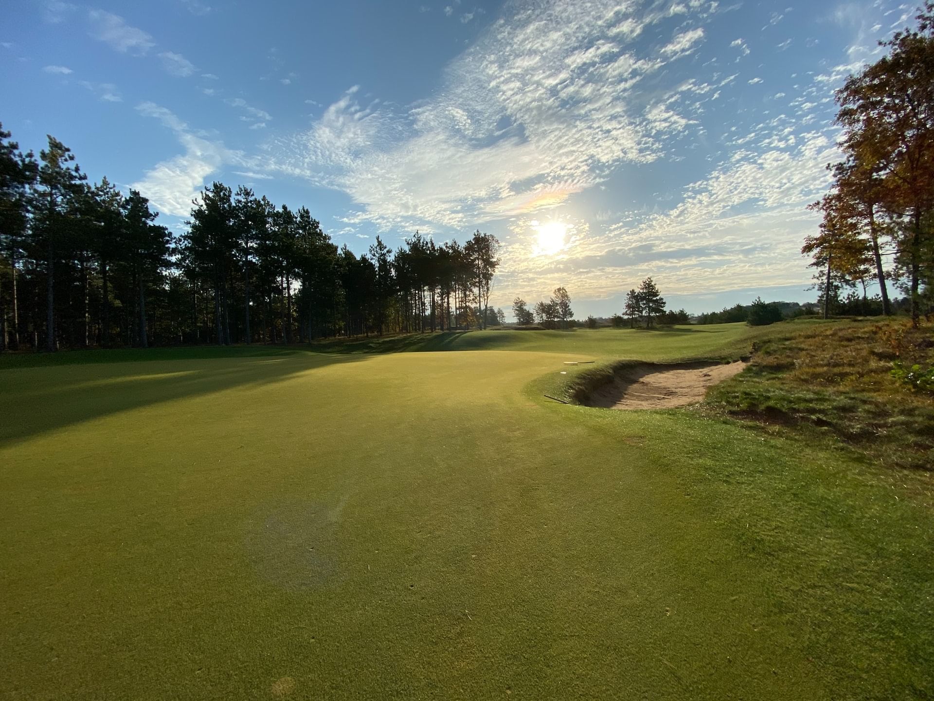 Indian Lake Golf Course with lush greenery and sunset sky at Atlantica Hotel Halifax in Halifax.