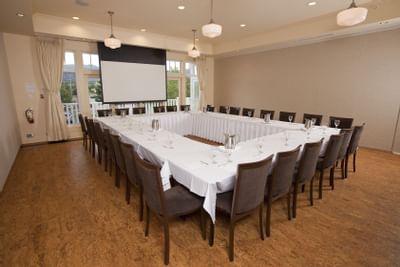 Meeting room with broad conference seating.