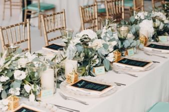 Floral table decor arranged for a wedding ceremony at Sebasco Harbor Resort