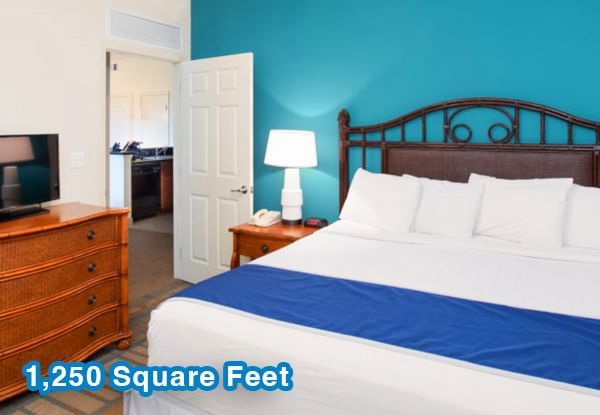 TV & nightstand by the bed in 3 Bedroom 2 Bath Suite at Lake Buena Vista Resort Village & Spa