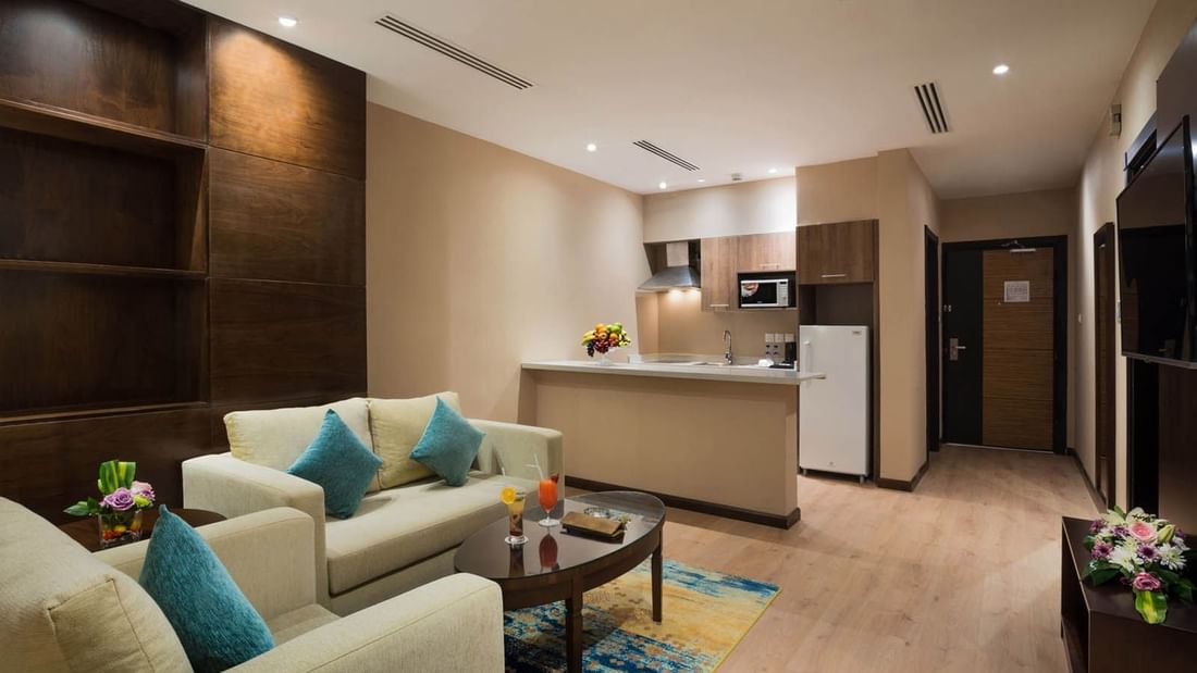 Living space and kitchenette in Family Suite at Naviti By Warwick Dammam