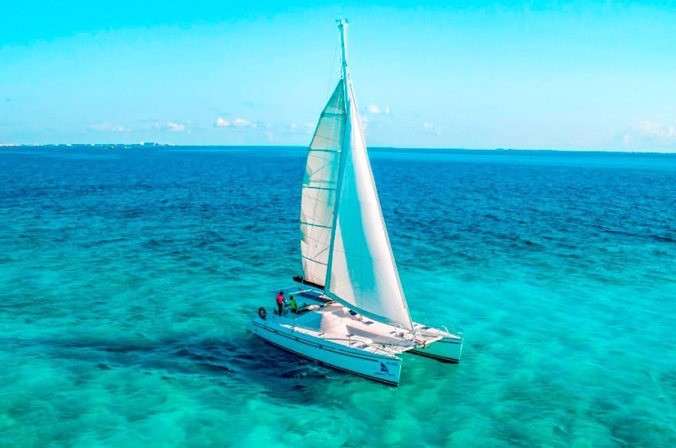 A sailboat in the ocean near The Reef 28