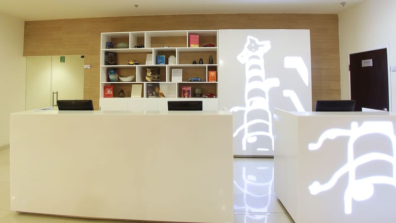 Reception counter in the lobby area at Fiesta Inn Coatzacoalcos