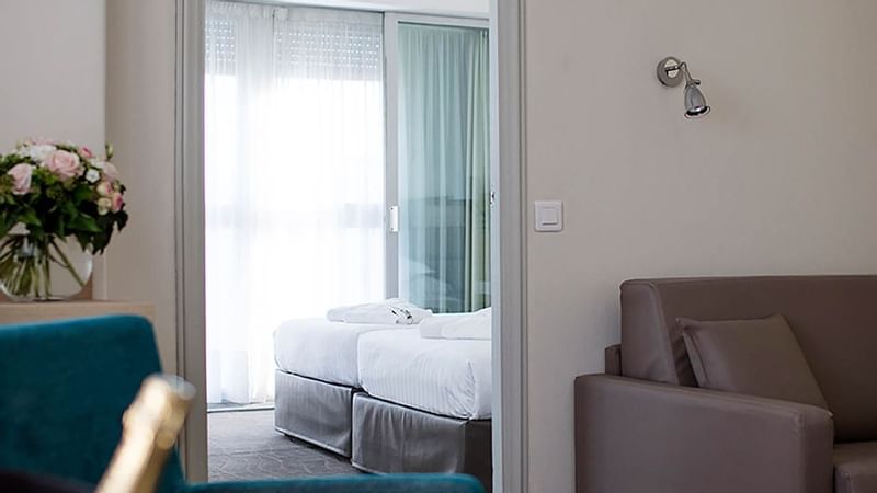 Comfy sofa and bedroom view of Suite at Splendid Hotel & Spa Nice