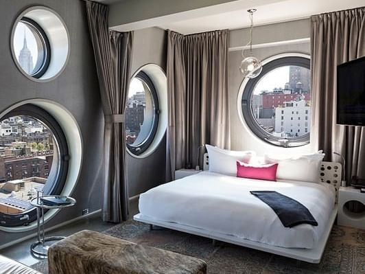 A suite with a king size bed at Dream Downtown NYC