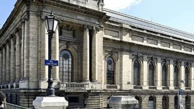 Musee Art et Histoire building by a street lamp under a soft blue sky near Warwick Geneva