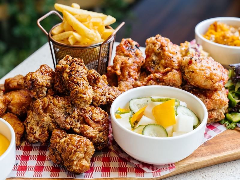 Crispy fried chicken with fries, salad & dipping sauce at Crown Hotels