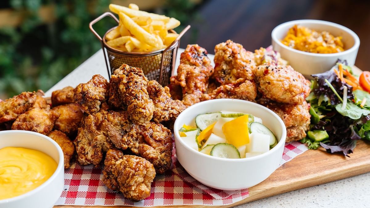 Crispy fried chicken with fries, salad & dipping sauce at Crown Hotels