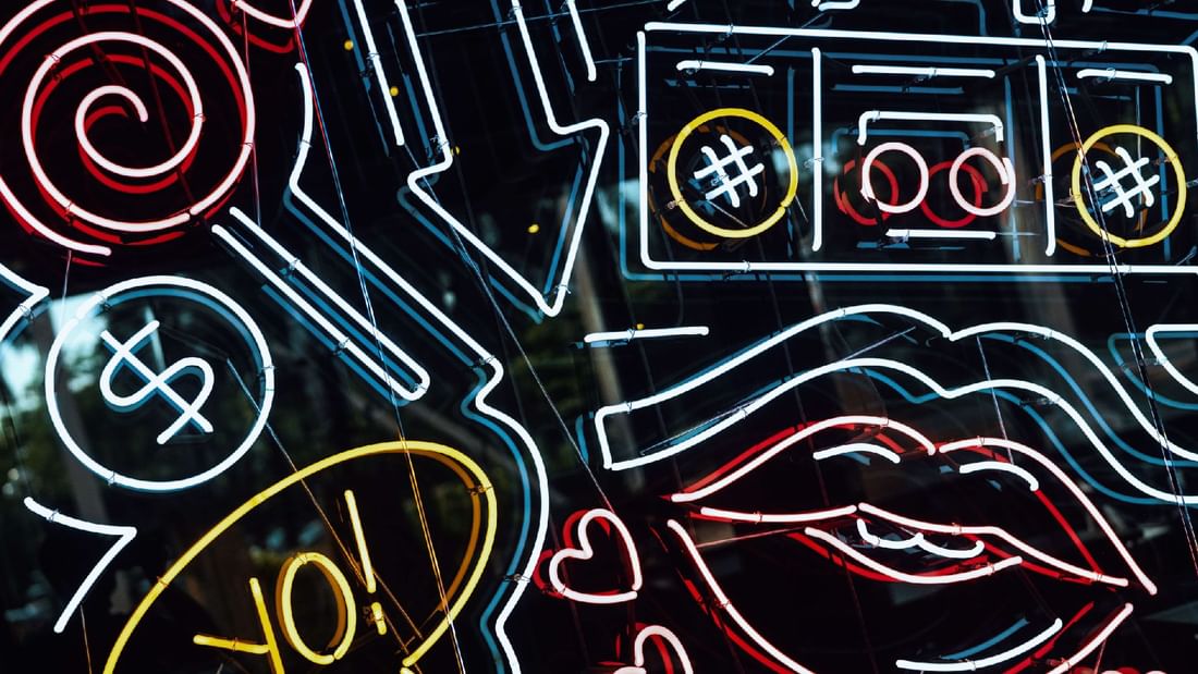 A neon sign displaying symbols and words at Sunway Resort