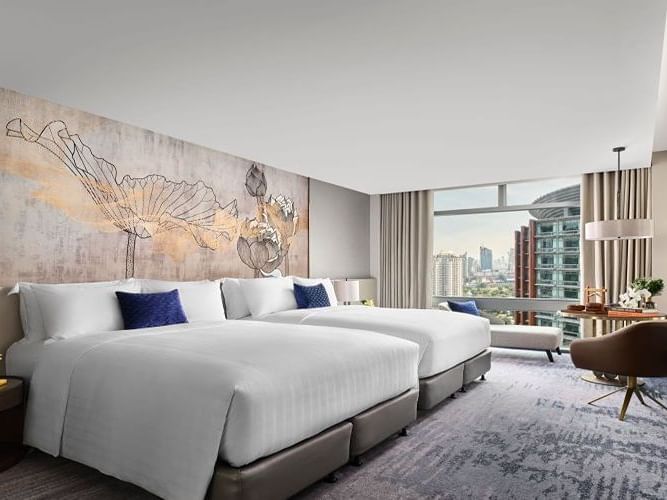Twin beds with city view in Family Room at Chatrium Grand Bangkok