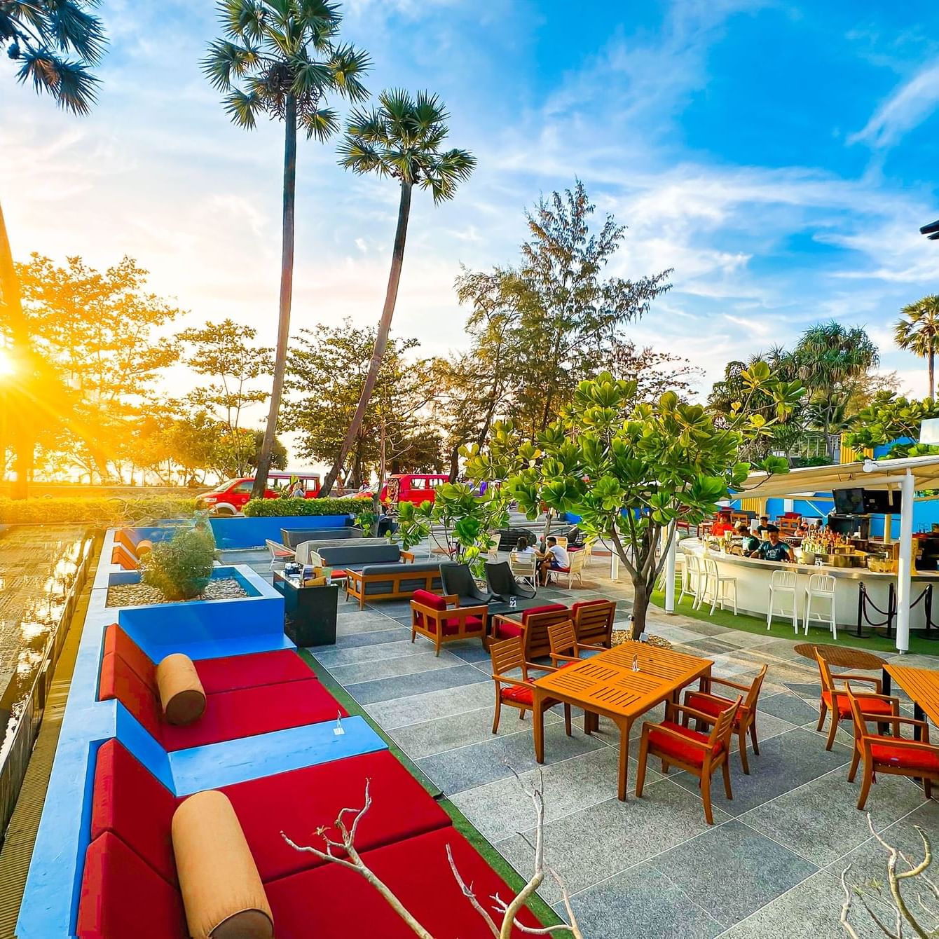 MINT Bar & Restaurant during the golden hours on Karon Beach with sofa areas, suitable for families and couples