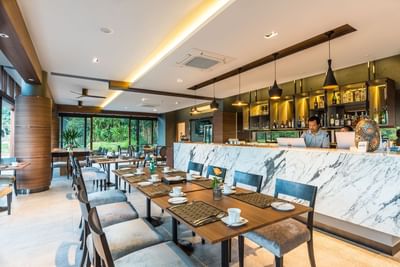 Communal tables at Chatrium Golf Resort Soi Dao's Restaurant