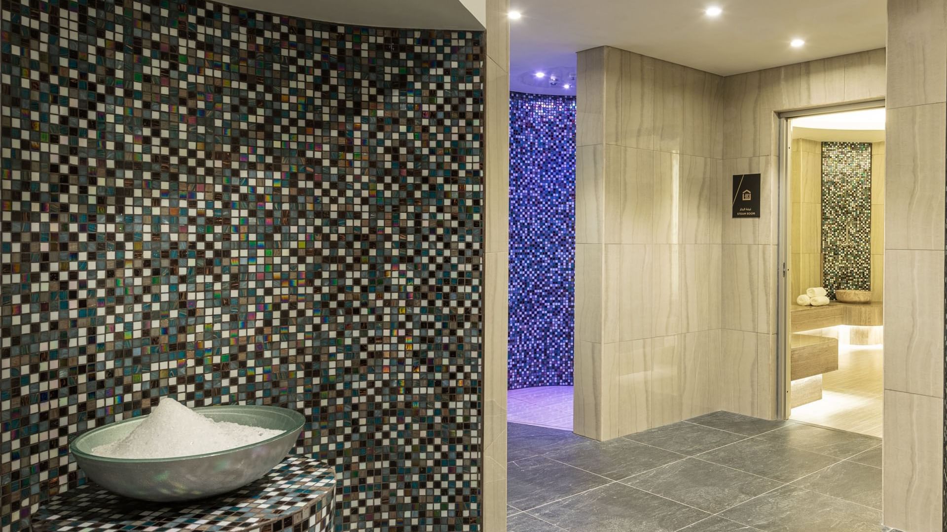 Spa Thermal facility area with mosaic tiled walls at DAMAC Maison Aykon City Hotel Apartments