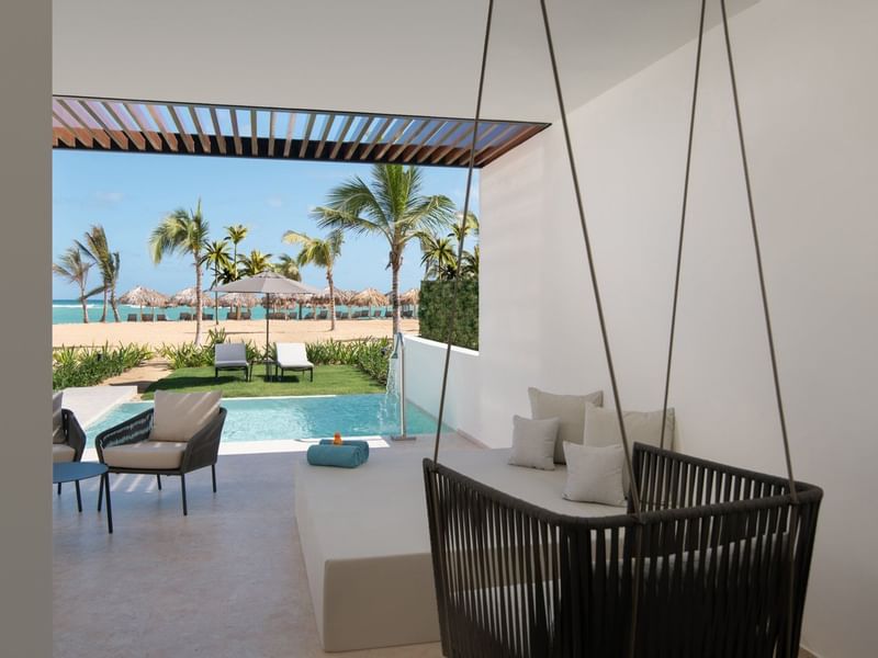 Patio with swing chair near the pool at Live Aqua Beach Resort