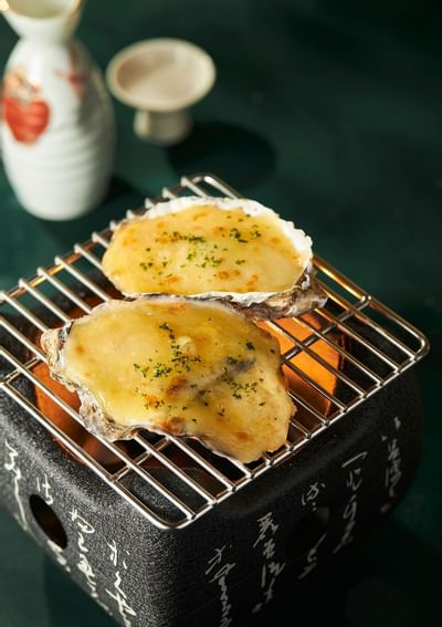 Close-up of Grilled cheese oyster dish at Hanoi Daewoo Hotel