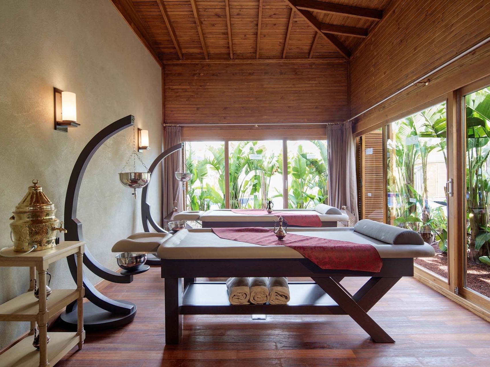 Massage beds and the outdoor view in BeFine Spa at Titanic Deluxe Golf Belek