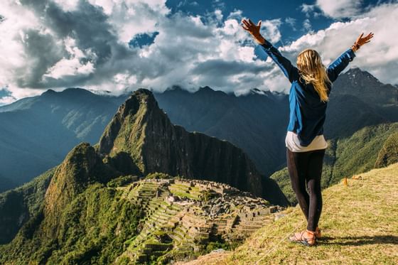 A girl on top of Machu Picchu mountain near Hotel Sumaq