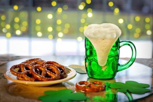 Foamy green beer and pretzels served in Frankie Farrell’s Irish Pub & Grille at Lake Buena Vista Resort Village & Spa